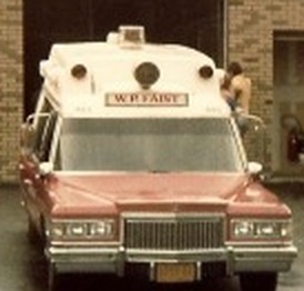One of the Corps' early ambulances, parked outside the original headquarters